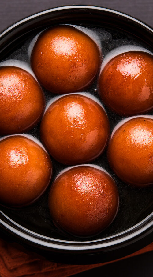 Sweet,Gulab,Jamun,Served,In,Black,Ceramic,Bowl